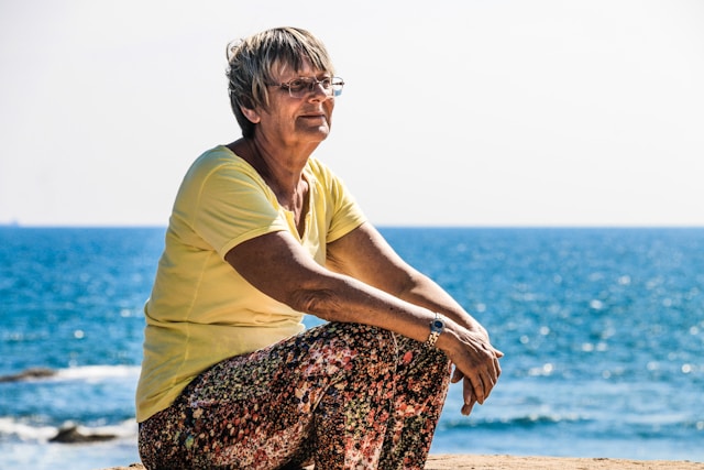 Lady sitting by the seaside